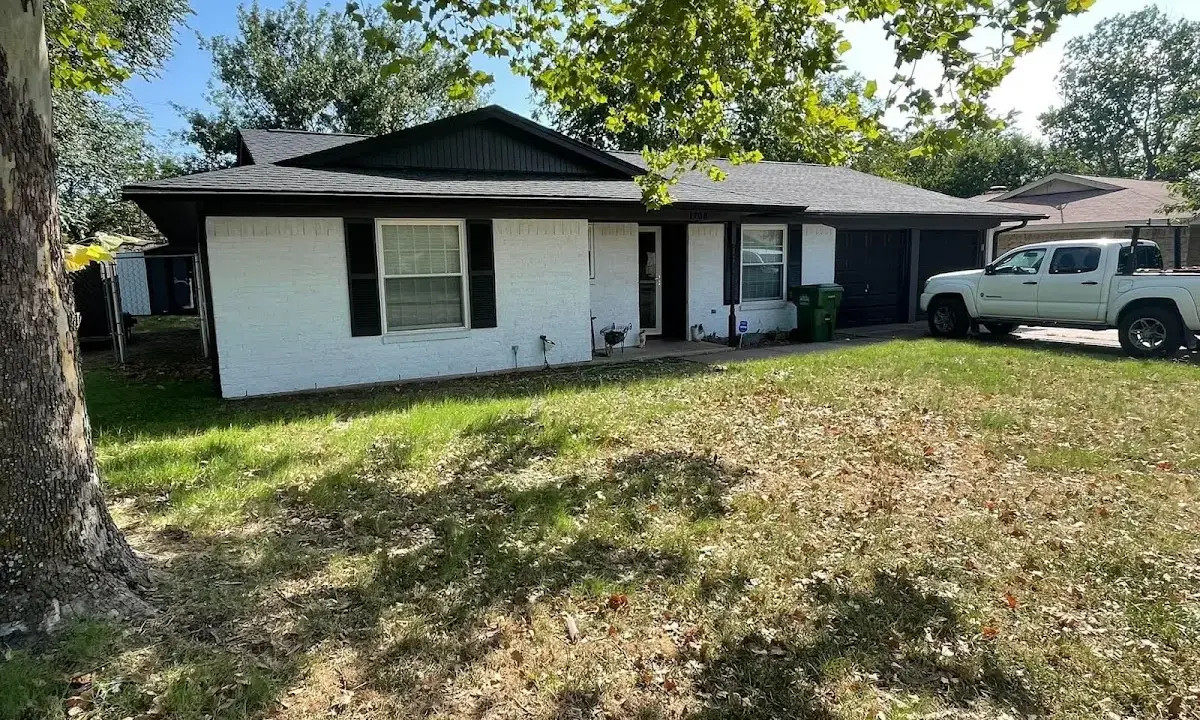 Professional roofing crew working on a residential roof in Altoona